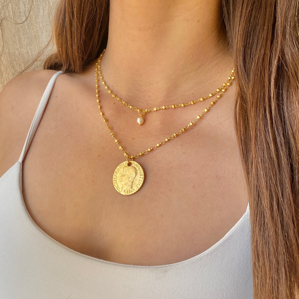 string necklace with coin
and pearl 18k plated